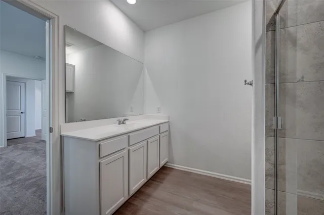 a bathroom with a shower and toilet