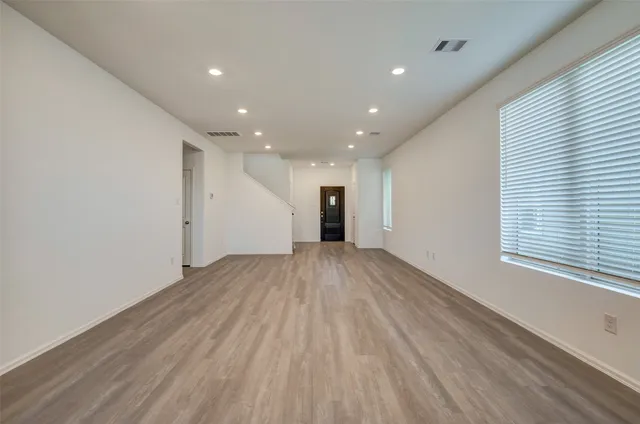 a view of kitchen with furniture and wooden floor