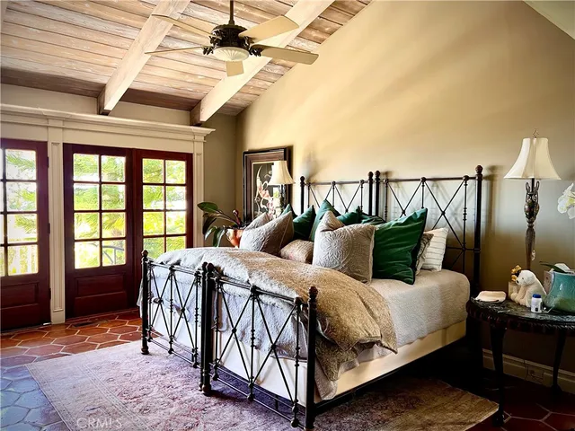 a bathroom with a granite countertop toilet a sink and a mirror