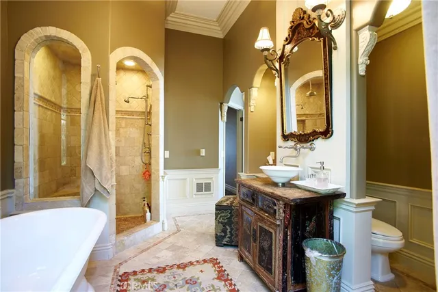 a spacious bathroom with a granite countertop tub and a sink