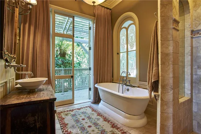a bathroom with a tub and shower