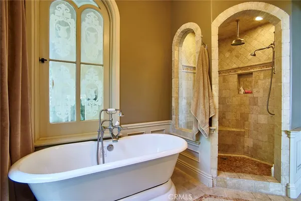 a spacious bathroom with a granite countertop sink a mirror and a shower