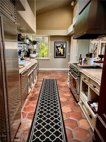 a balcony with table and chairs