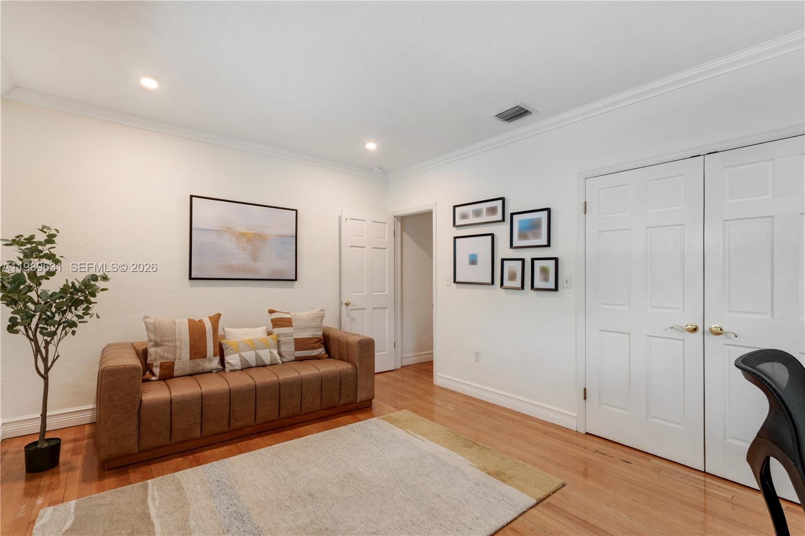426 Hardee Road Coral Gables, FL 33146 - Photo 12 of 20 a living room with furniture and a potted plant