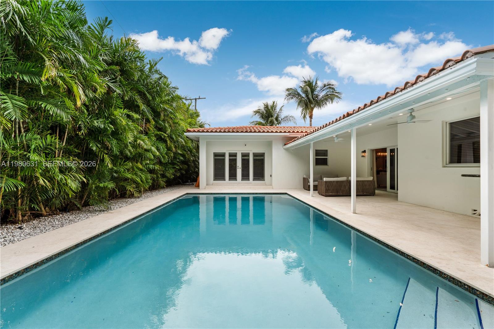 426 Hardee Road Coral Gables, FL 33146 - Photo 2 of 20 a front view of a house with swimming pool having outdoor seating
