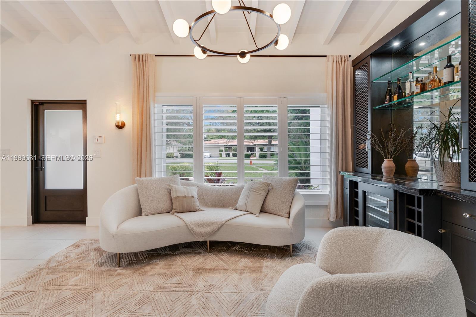 426 Hardee Road Coral Gables, FL 33146 - Photo 4 of 20 a living room with furniture a lamp and a large window