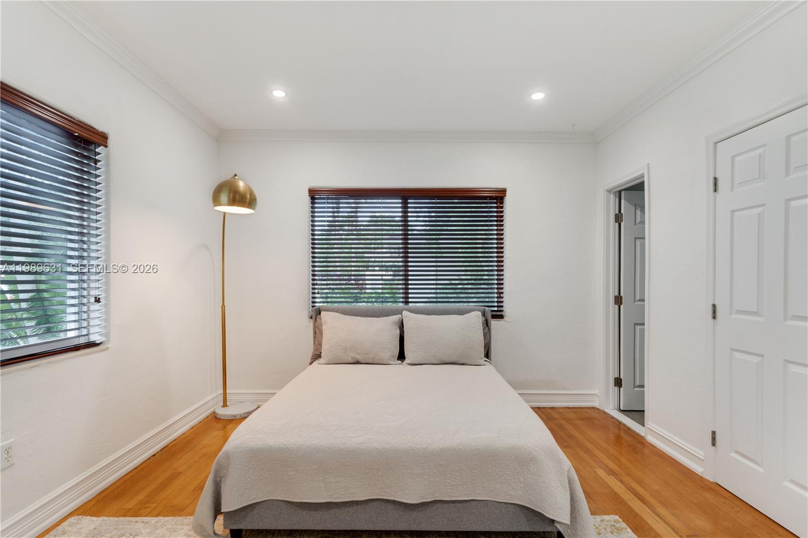 426 Hardee Road Coral Gables, FL 33146 - Photo 9 of 20 a bedroom with a large bed and a window
