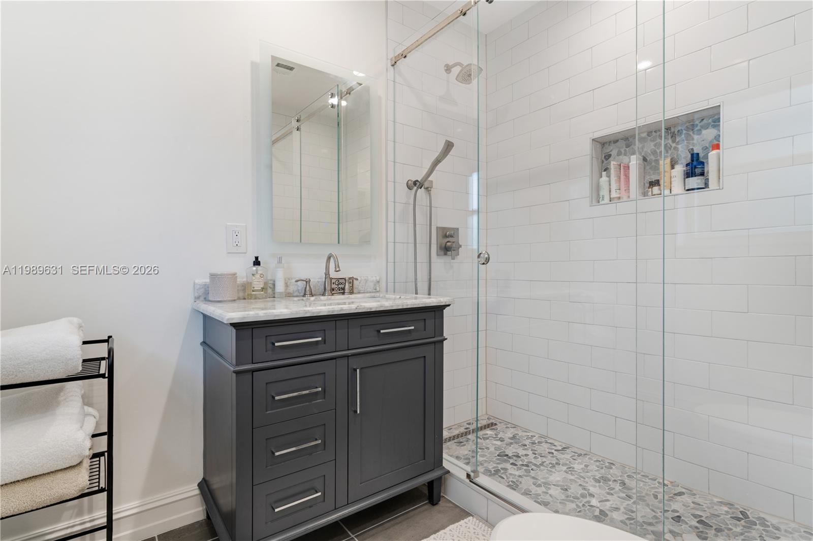 426 Hardee Road Coral Gables, FL 33146 - Photo 10 of 20 a bathroom with a sink a vanity and a mirror