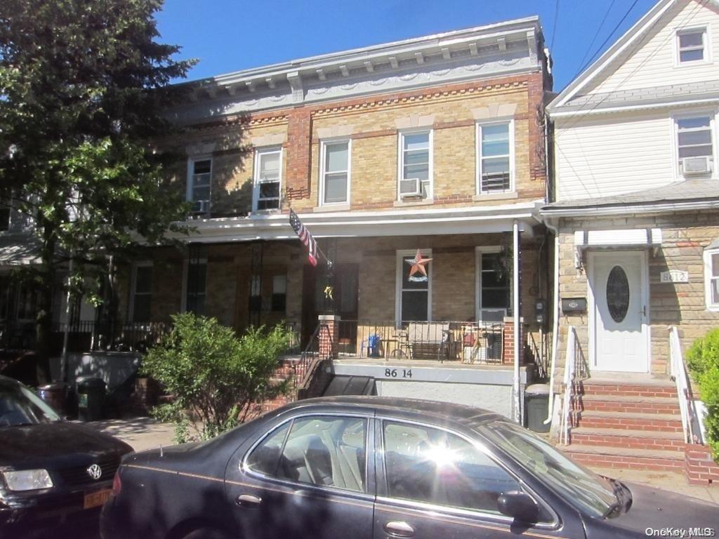 86-14 89th Street Queens, NY 11421 - Photo 1 of 1 front view of a house with a yard