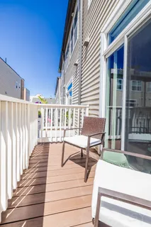 a view of a chairs and a tables on the balcony