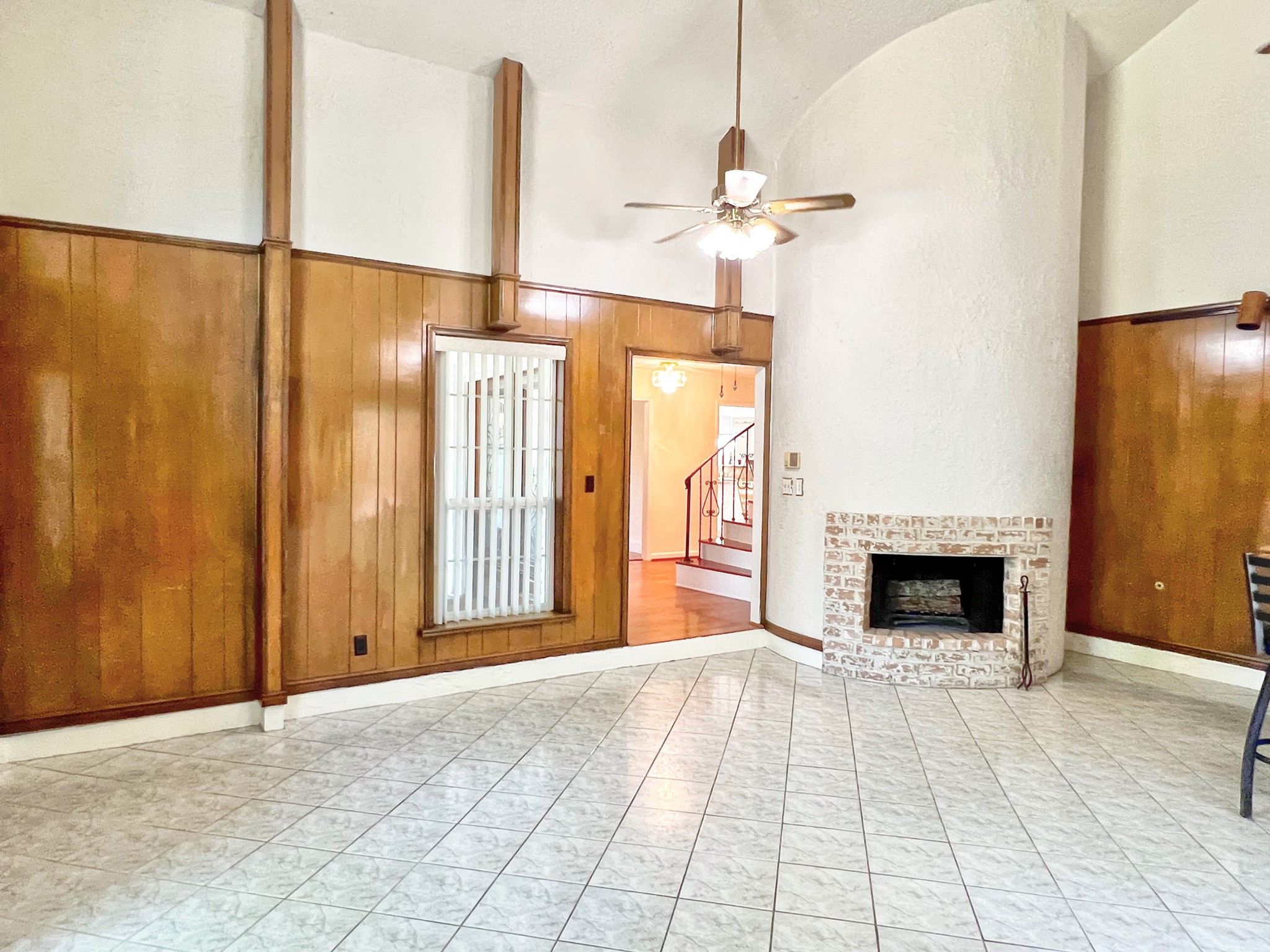 16902 Summit Oaks Lane Spring, TX 77379 - Photo 13 of 49 an empty room with windows and fireplace