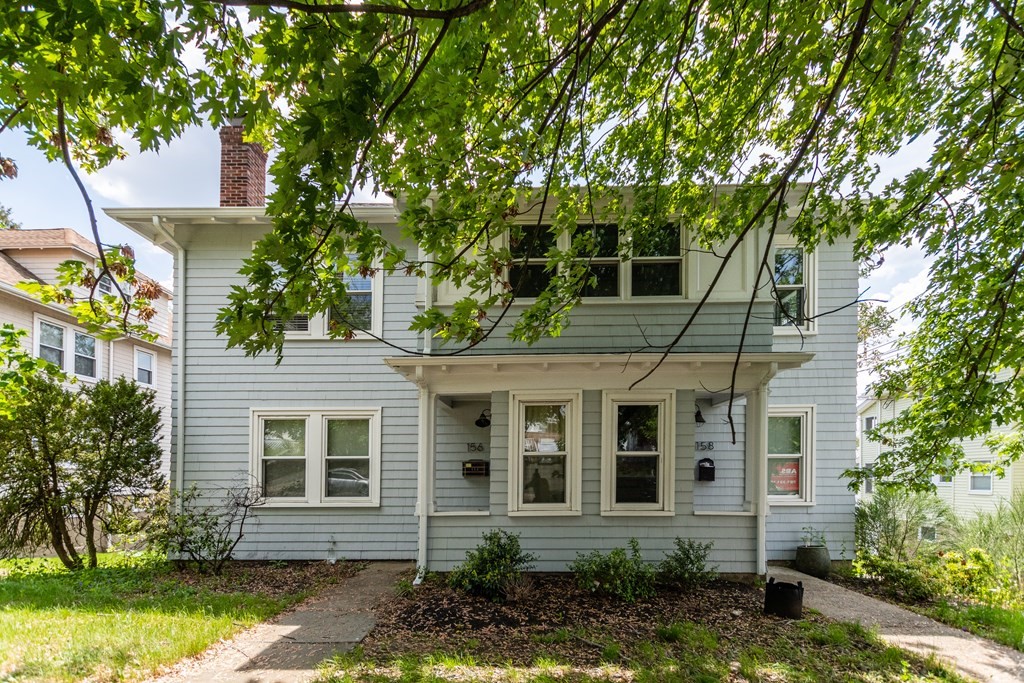 front view of a house with a yard