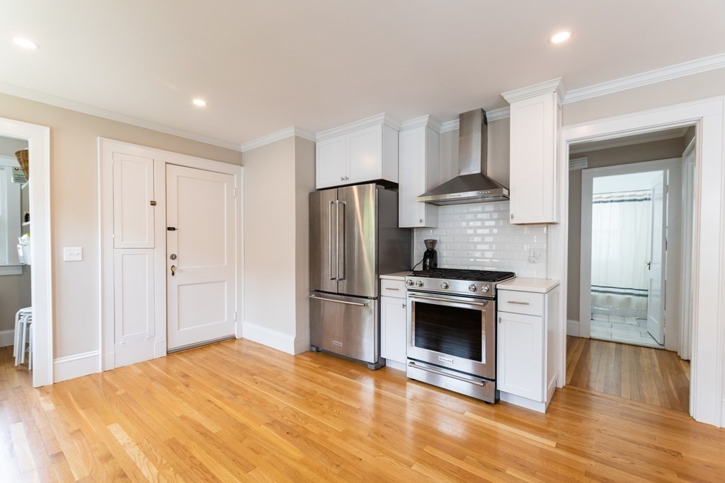 156-158 Trapelo Road Belmont, MA 02478 - Photo 11 of 20 a kitchen with stainless steel appliances granite countertop a stove and a refrigerator