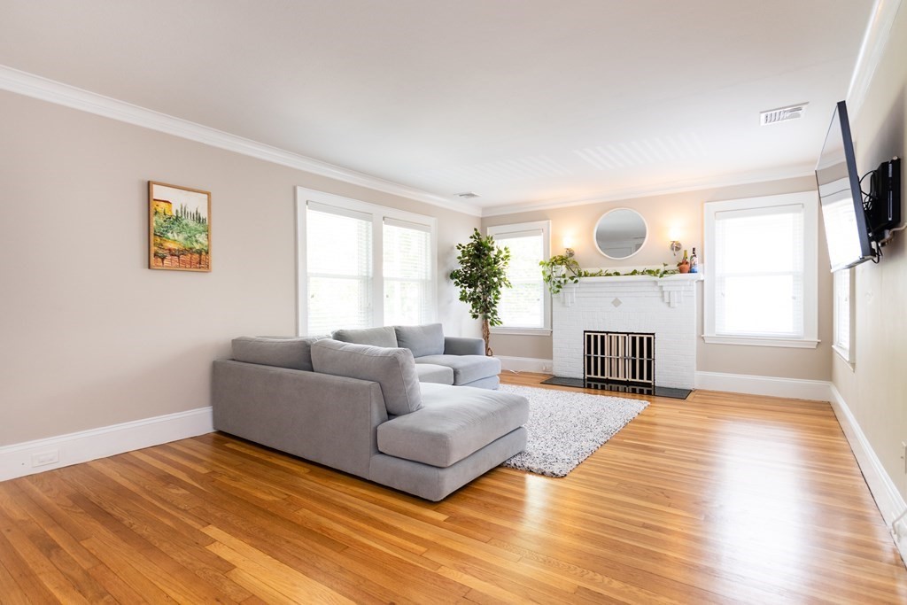 156-158 Trapelo Road Belmont, MA 02478 - Photo 2 of 20 a living room with furniture and a fireplace