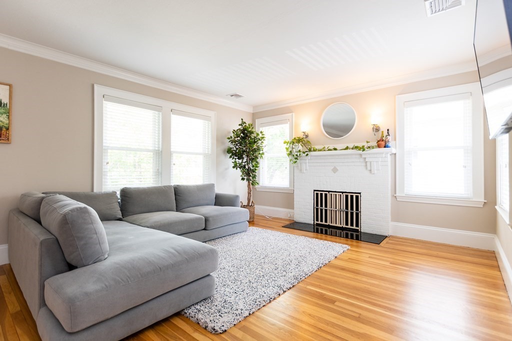 156-158 Trapelo Road Belmont, MA 02478 - Photo 3 of 20 a living room with furniture a fireplace and a large window