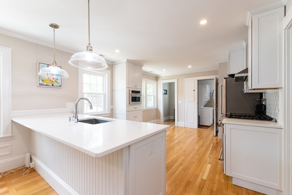 156-158 Trapelo Road Belmont, MA 02478 - Photo 8 of 20 a kitchen with stainless steel appliances a sink a counter top space appliances and cabinets