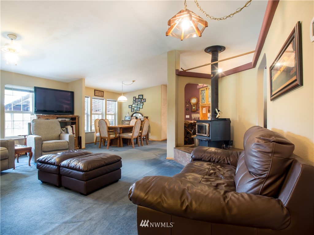 8941 Heady Road Maple Falls, WA 98266 - Photo 12 of 40 a living room with furniture and a flat screen tv