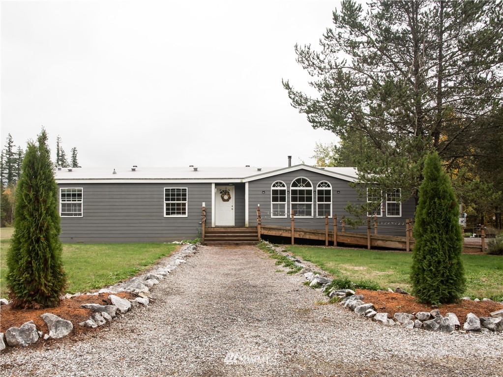 8941 Heady Road Maple Falls, WA 98266 - Photo 8 of 40 a front view of a house with a garden