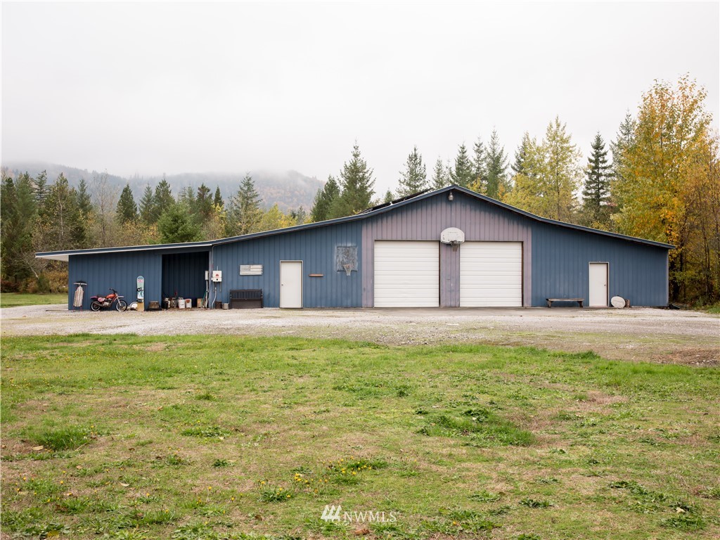 8941 Heady Road Maple Falls, WA 98266 - Photo 9 of 40 a view of a house with pool yard and fire pit