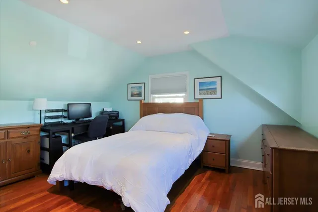 a bed room with a bed and a night stand