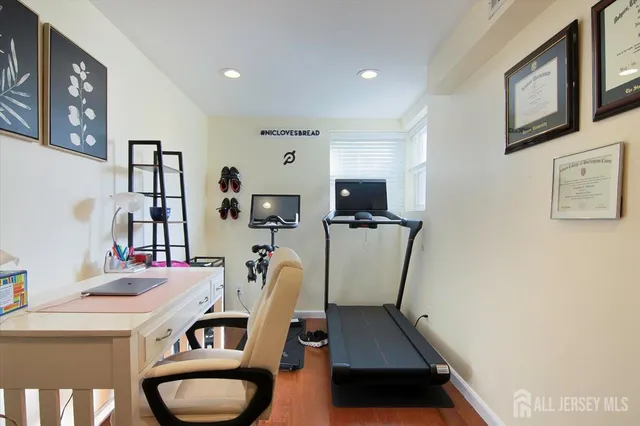 a room with furniture a flat screen tv and a window