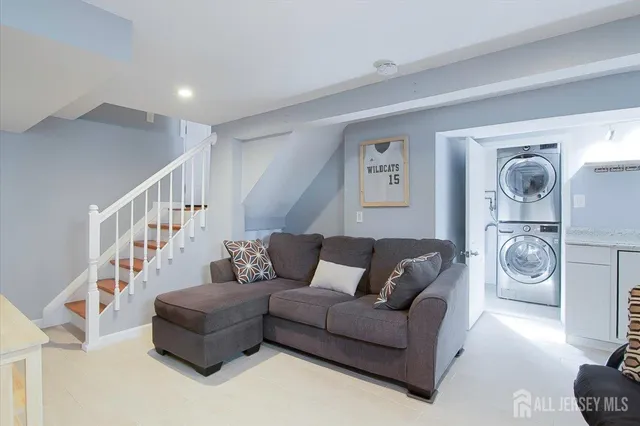 a living room with furniture and a rug