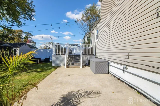 a view of a patio with couches and potted plants