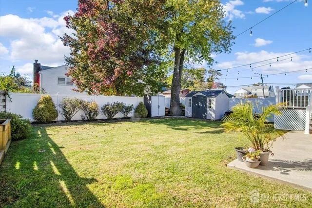 a swimming pool with outdoor seating and yard