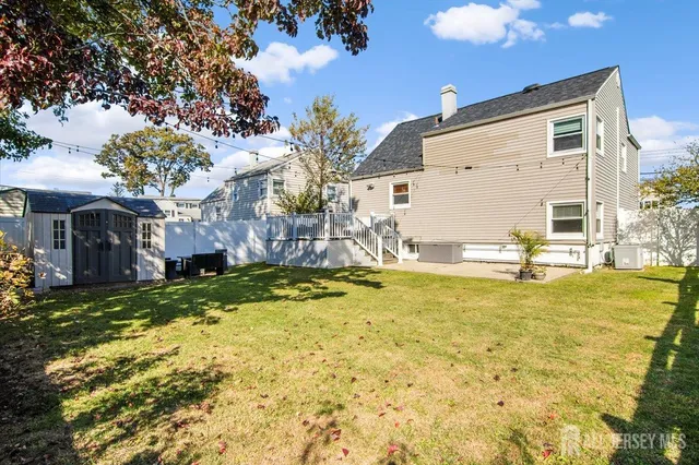 a view of swimming pool with a backyard