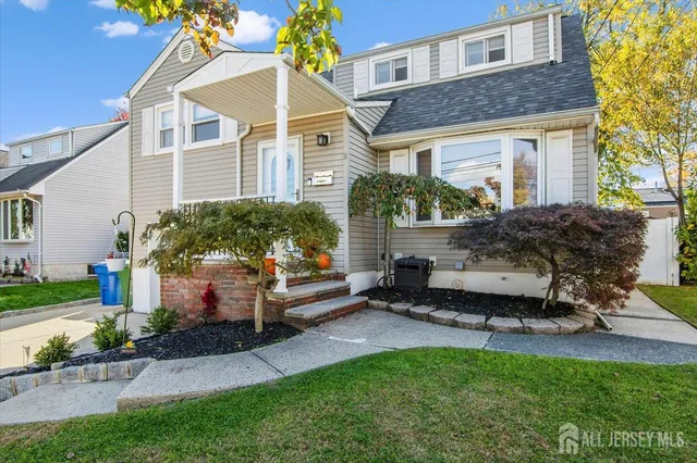 a house view with a sitting space and garden
