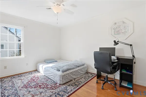 a workspace with furniture and chandelier