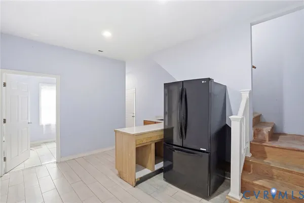 a kitchen with stainless steel appliances a refrigerator and a stove
