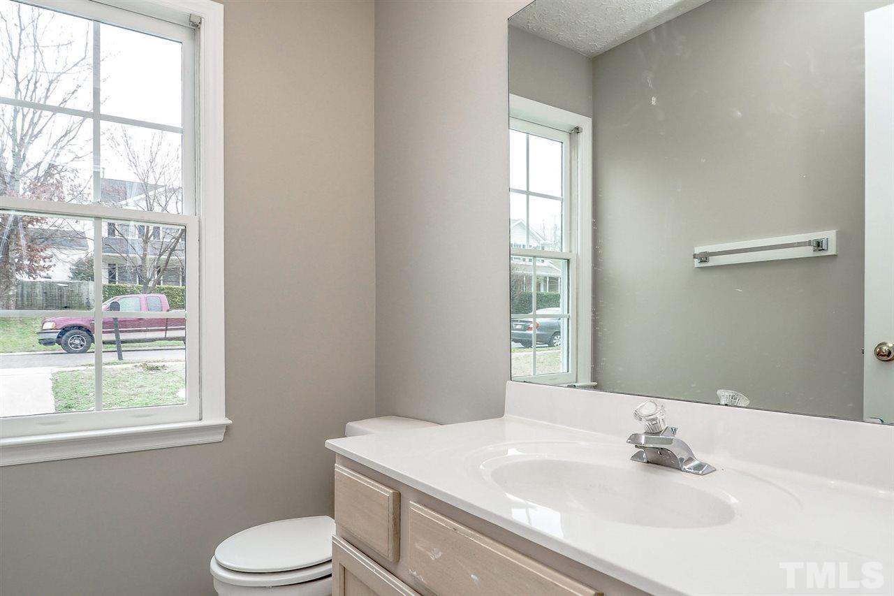 5333 Spring Pines Way Raleigh, NC 27616 - Photo 20 of 25 a bathroom with a sink toilet and window