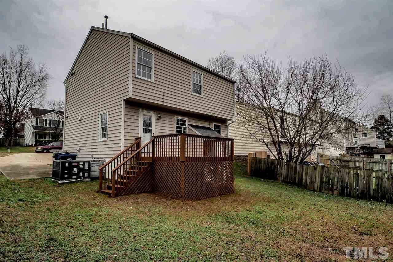 5333 Spring Pines Way Raleigh, NC 27616 - Photo 23 of 25 a front view of a house with garden