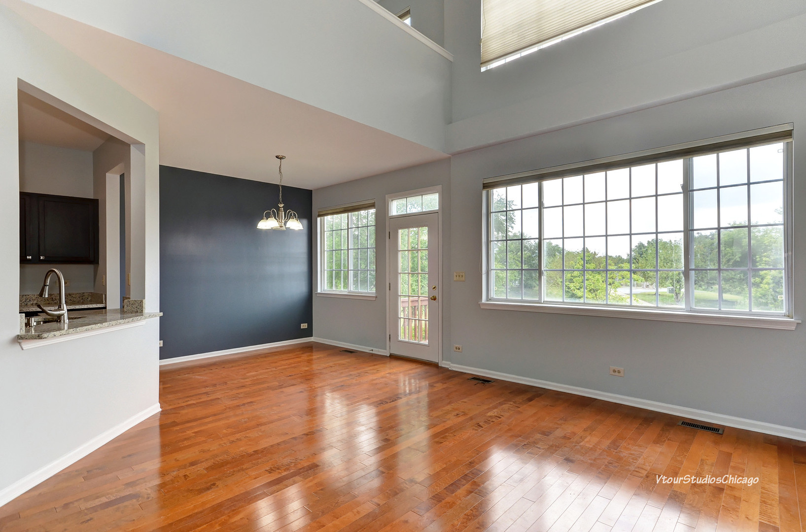 5451 Elizabeth Place Rolling Meadows, IL 60008 - Photo 12 of 34 a view of empty room with wooden floor and fan