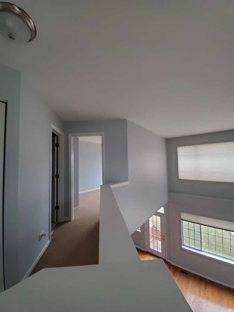 5451 Elizabeth Place Rolling Meadows, IL 60008 - Photo 15 of 34 an empty room with windows