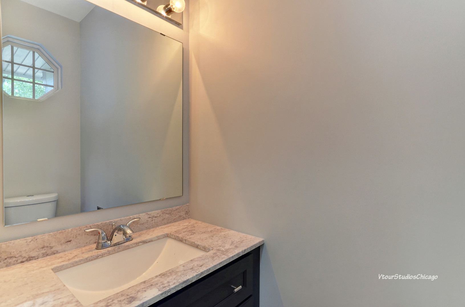 5451 Elizabeth Place Rolling Meadows, IL 60008 - Photo 23 of 34 a bathroom with a granite countertop sink and a mirror