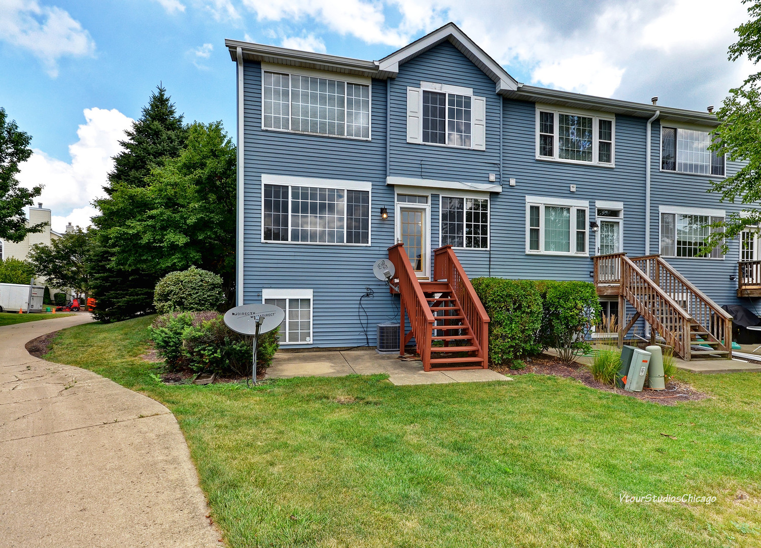 5451 Elizabeth Place Rolling Meadows, IL 60008 - Photo 34 of 34 a front view of a house with patio and garden