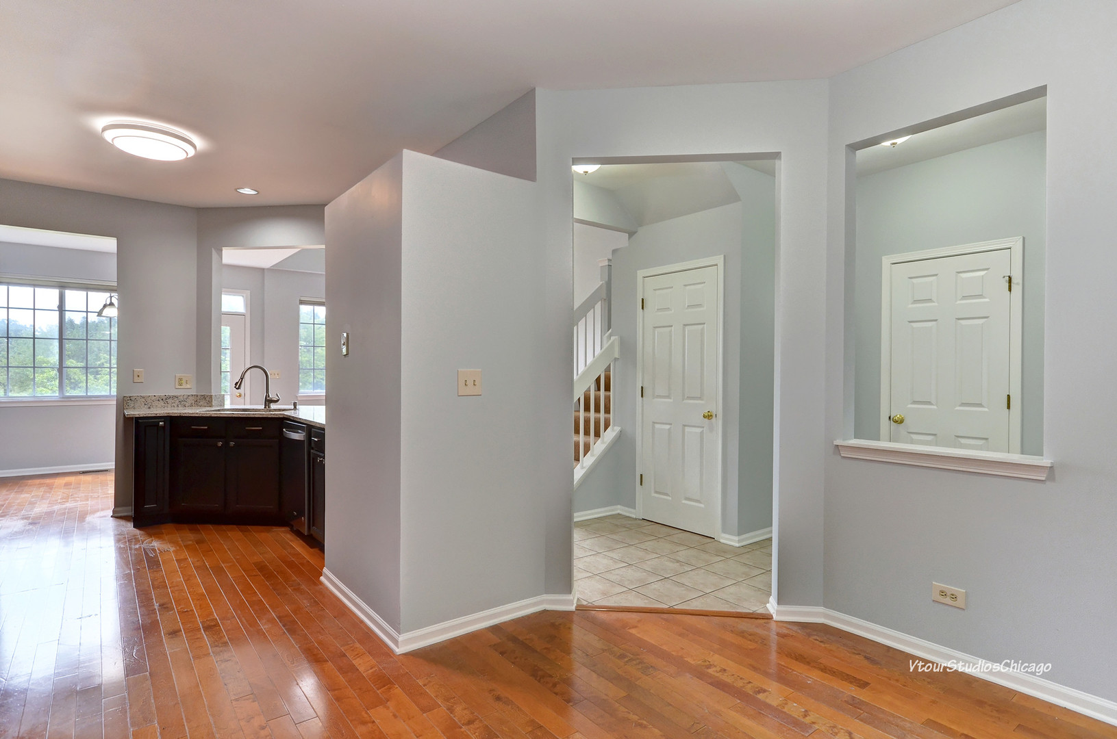 5451 Elizabeth Place Rolling Meadows, IL 60008 - Photo 5 of 34 wooden floor in an empty room with a window