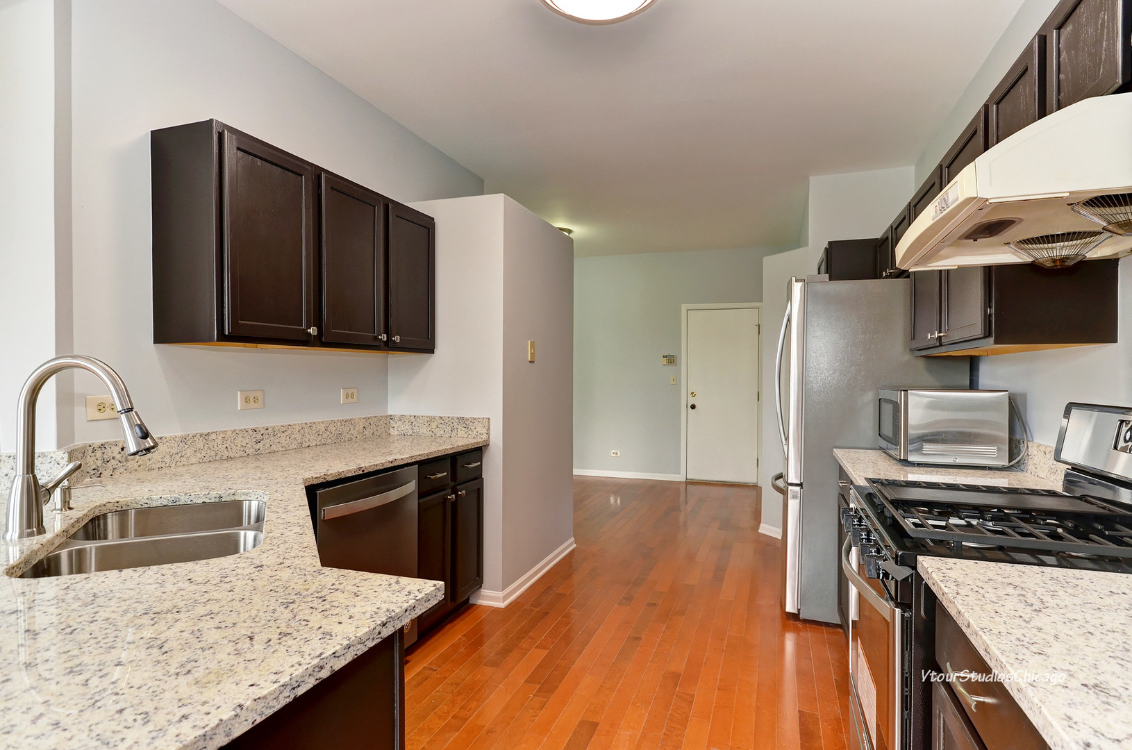 5451 Elizabeth Place Rolling Meadows, IL 60008 - Photo 8 of 34 a kitchen with granite countertop stainless steel appliances and wooden cabinets