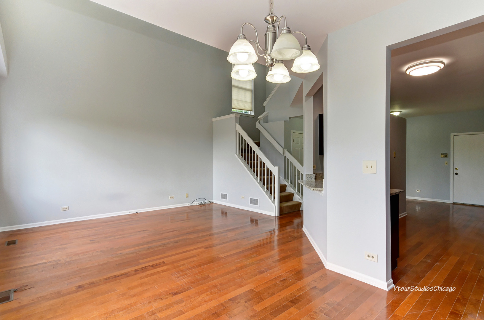 5451 Elizabeth Place Rolling Meadows, IL 60008 - Photo 9 of 34 a view of a hallway with wooden floor and staircase