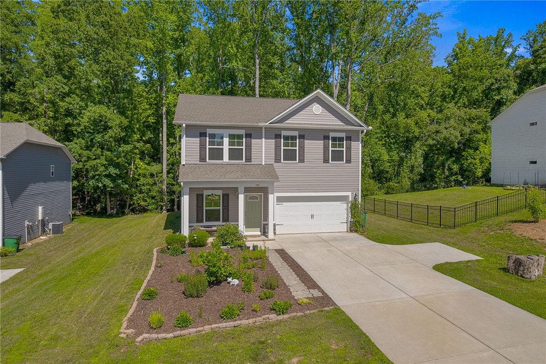 430 Johnson Road Central, SC 29630 - Photo 1 of 36 A welcoming front porch leads into this charming two-story home, featuring a manicured front yard and a well-maintained driveway.
