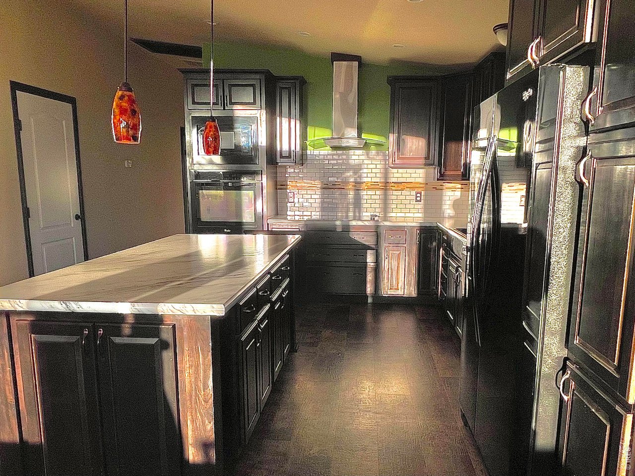 892 Stratton Park Road Bellvue, CO 80512 - Photo 5 of 27 a kitchen with stainless steel appliances granite countertop a refrigerator a stove and a sink