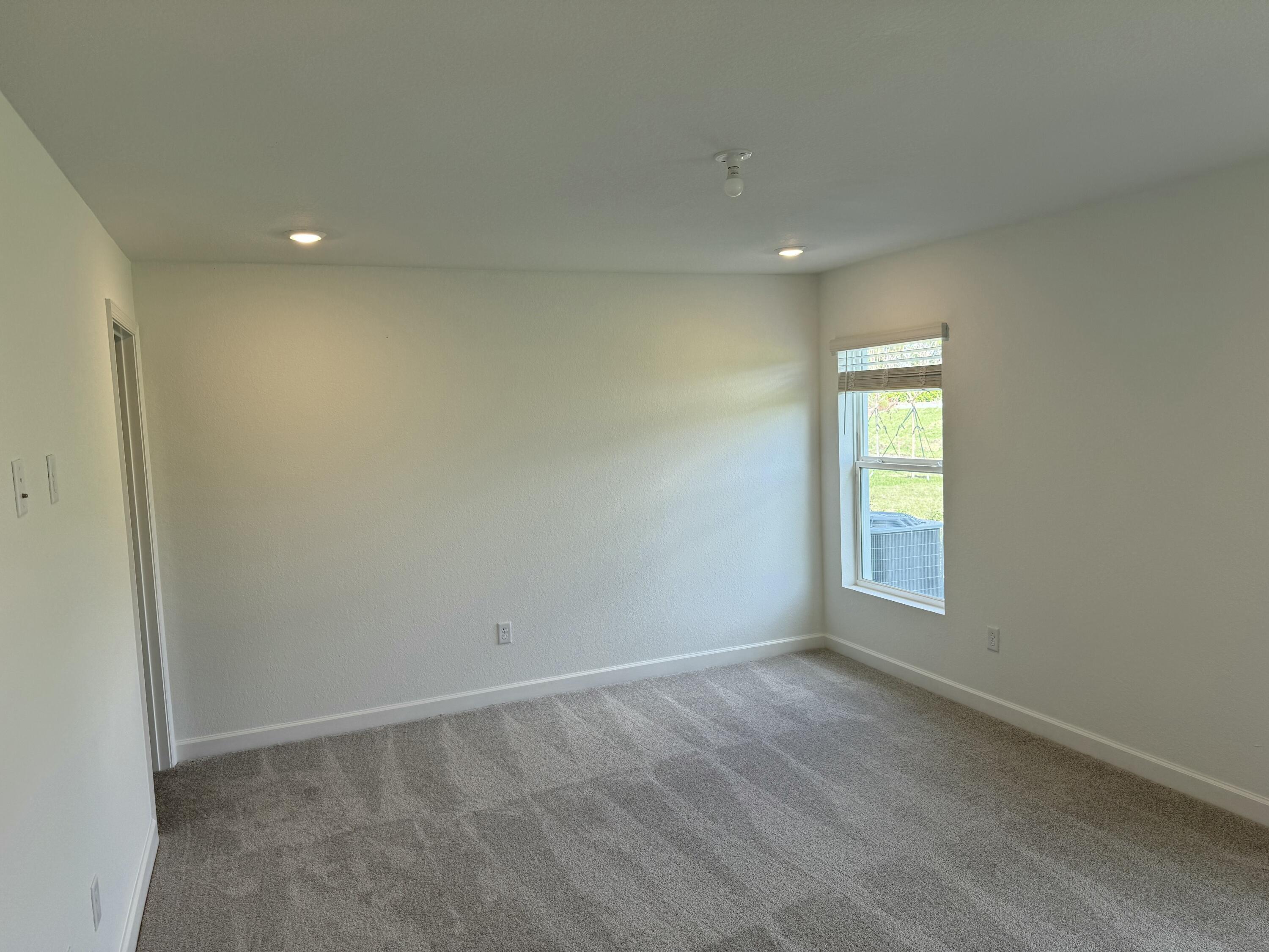 10501 Northwest Suncrest Loop Port St. Lucie, FL 34987 - Photo 12 of 33 an empty room with windows and closet