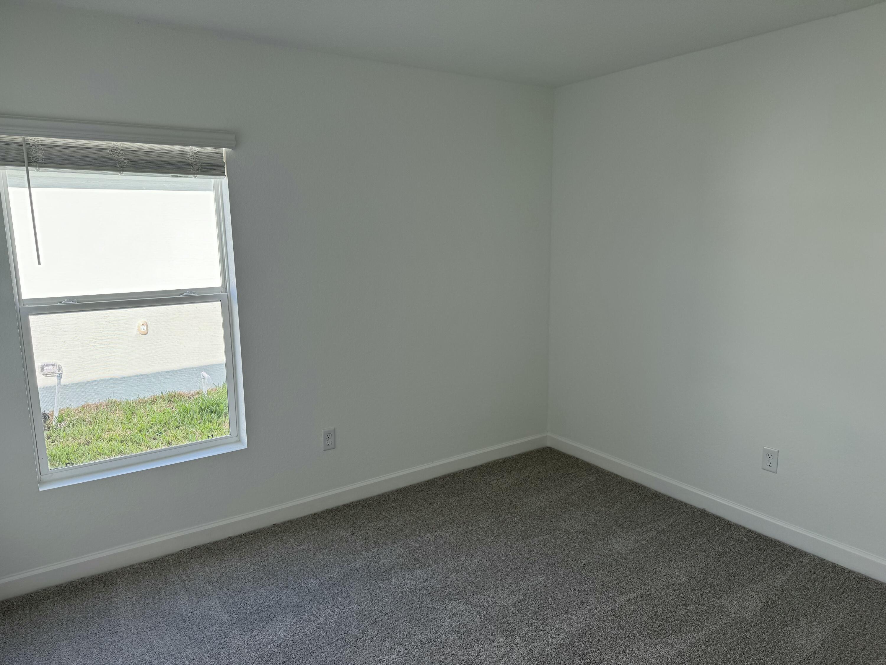 10501 Northwest Suncrest Loop Port St. Lucie, FL 34987 - Photo 18 of 33 an empty room with a window