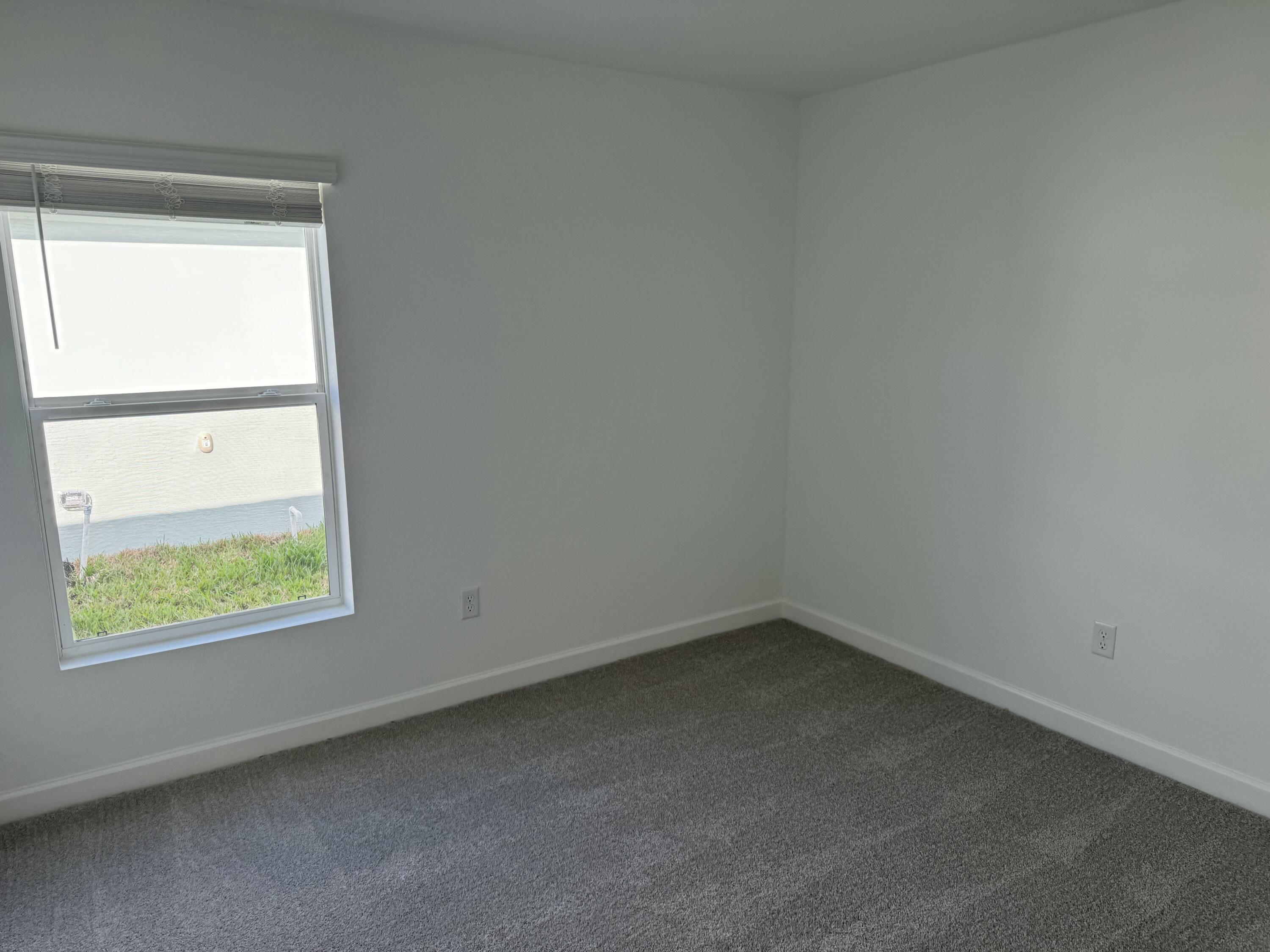 10501 Northwest Suncrest Loop Port St. Lucie, FL 34987 - Photo 19 of 33 an empty room with a window