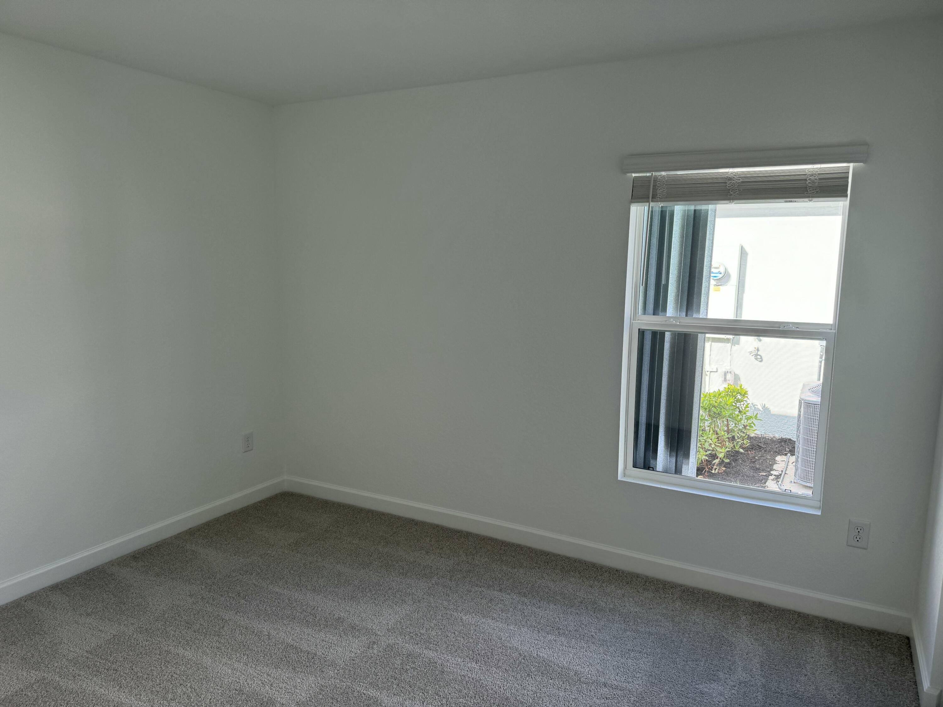 10501 Northwest Suncrest Loop Port St. Lucie, FL 34987 - Photo 20 of 33 an empty room with a window