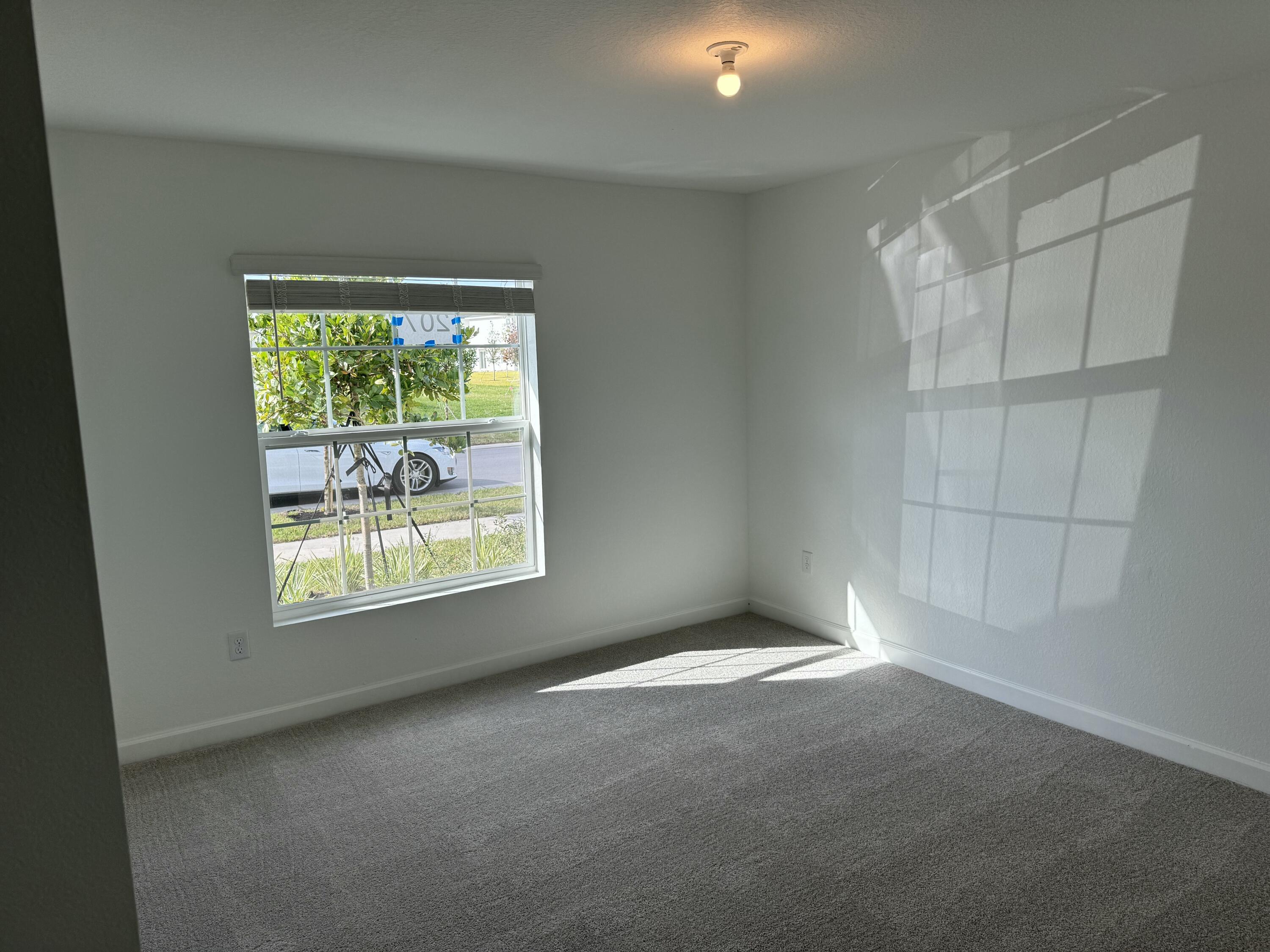 10501 Northwest Suncrest Loop Port St. Lucie, FL 34987 - Photo 22 of 33 an empty room with a window