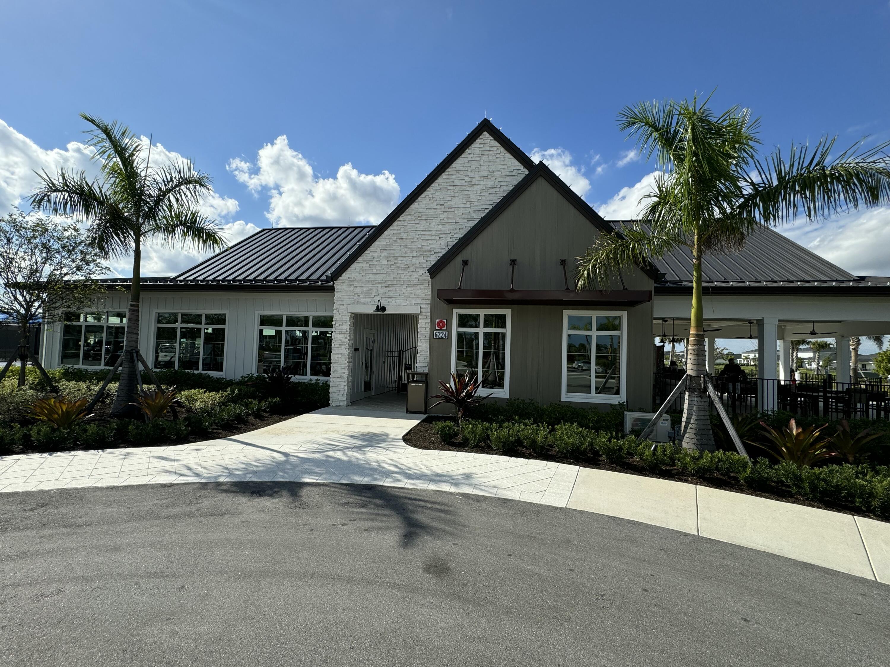 10501 Northwest Suncrest Loop Port St. Lucie, FL 34987 - Photo 33 of 33 a front view of a house with a yard