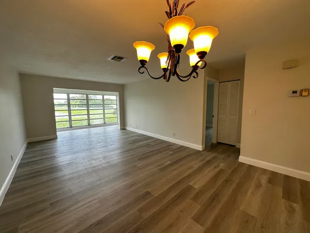 a view of a livingroom with wooden floor